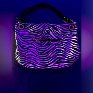 Brand new zebra purse bag. No name brand. Multiple compartments
